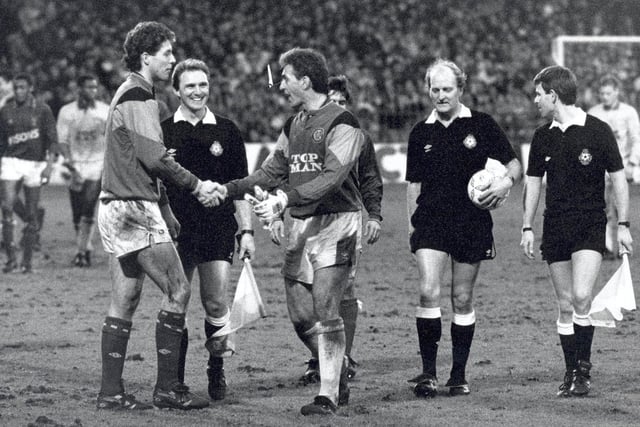 Mervyn Day and Craig Forrest shake hands at full time. Remember the overcrowding at Portman Road?