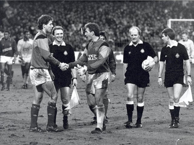 Mervyn Day and Craig Forrest shake hands at full time. Remember the overcrowding at Portman Road?