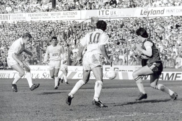 Lee Chapman shoots through a crowded penalty area to give the Whites the lead.