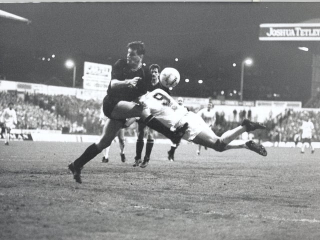 Lee Chapman and Gerry Taggart collide.