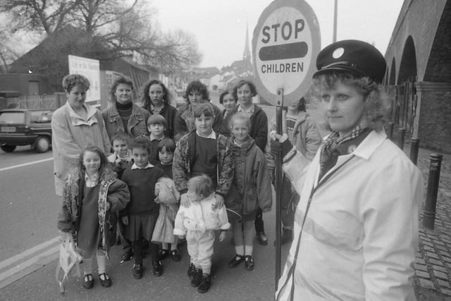 Parents are furious that a lollipop patrol guiding school children across a busy Preston road is to be axed. Hundreds of children are safely helped across the junction of Tulketh Brow and Waterloo Road under the watchful eye of lollipop lady Mrs Wendy Proctor. But police experts have decided the twice-daily peak hour patrol is to go. Mrs Wendy Proctor is pictured above with some of the parents and children