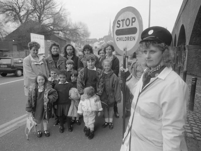 Parents are furious that a lollipop patrol guiding school children across a busy Preston road is to be axed. Hundreds of children are safely helped across the junction of Tulketh Brow and Waterloo Road under the watchful eye of lollipop lady Mrs Wendy Proctor. But police experts have decided the twice-daily peak hour patrol is to go. Mrs Wendy Proctor is pictured above with some of the parents and children