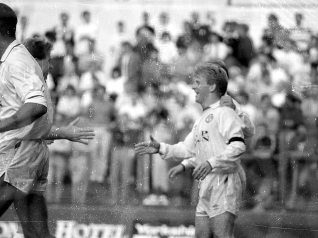 Gordon Strachan celebrates his hat-trick. Jon Gittens was sent off for a challenge on John Hendrie who was stretchered off.