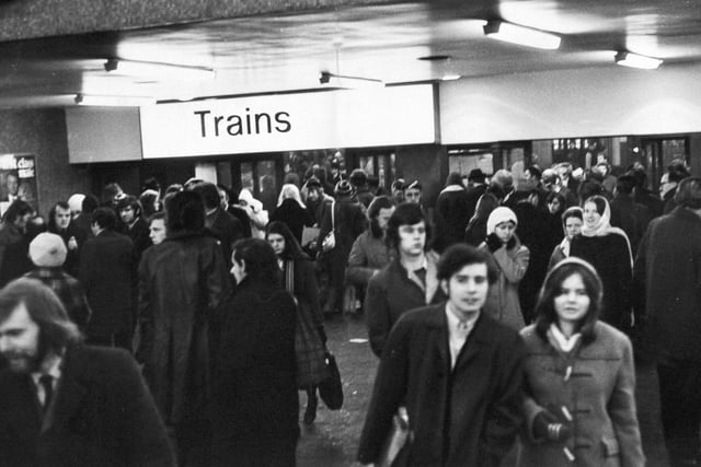 Passengers wait hopefully for trains at Leeds City Station.