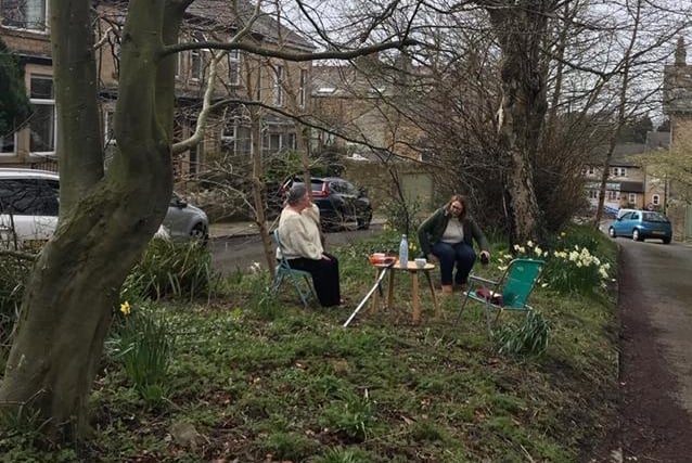 Elevenses in Lily Grove, Lancaster, avoiding social contact but supporting each other via a WhatsApp group and meeting in the middle of the street!