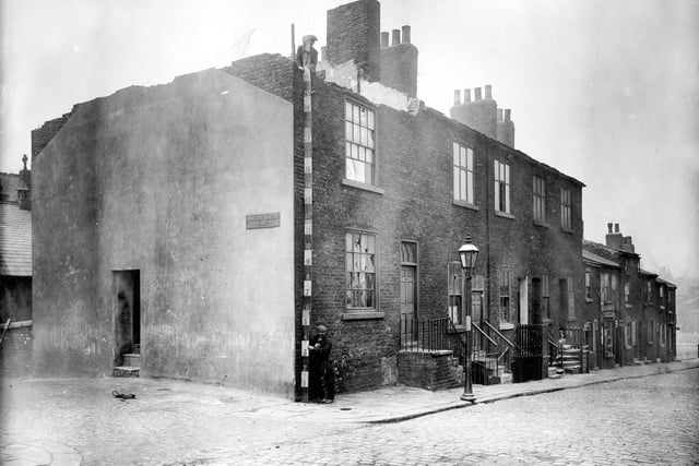 A row of Victorian terrace houses on Back High Street in Quarry Hill prior to demolition. The area was noted as having the most unhealthy slums in Leeds at that time.