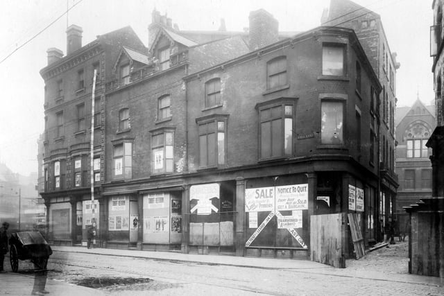 Photograph showing passage from Call Lane leading to New Market Street prior to improvement. Empty business premises which were formerly on left are cash Boot Co; James Skelton, saddlers and on corner was F. Willey, tool dealer.