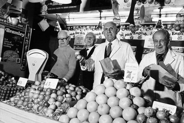 Jim Windsor (centre) pictured on one of the stalls in Kirkgate Market with three of his old pals from 60 years who still work in the market. Pictured, left to right, are Enoch Barber, George Brown, and Vinee Brooksbank.