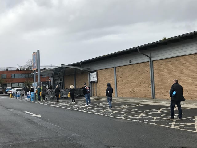 Social distancing in the queue for Aldi.