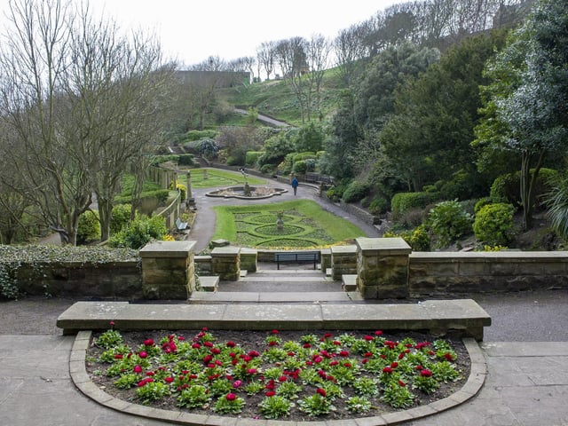 A lone walker in South Cliff gardens.