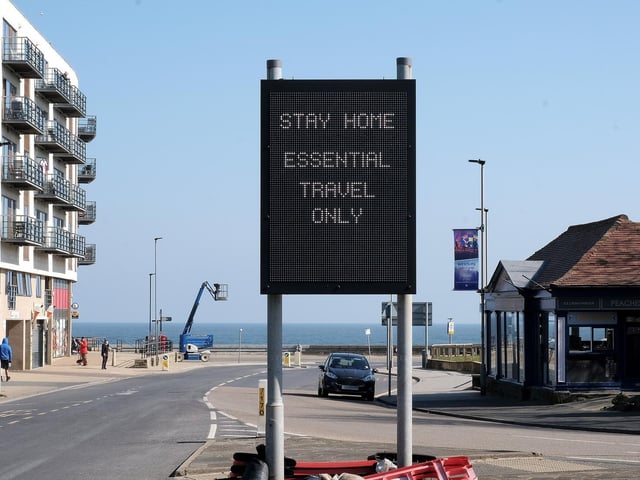 Signs warning the public against essential travel.