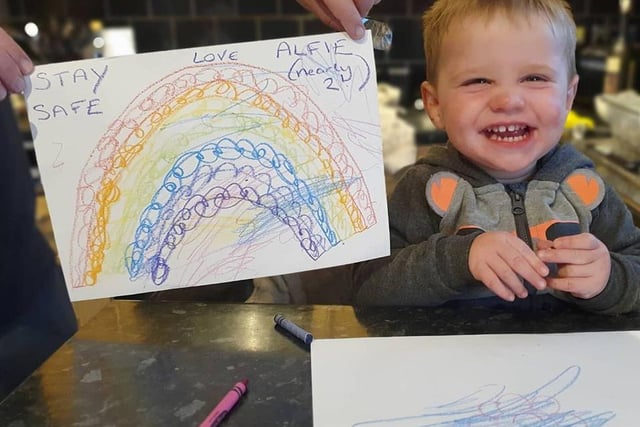 Alfie, nearly 2, looks very happy with his rainbow.