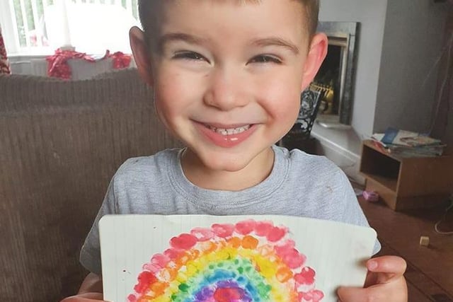 Jacob, age 3, used finger paints to create his rainbow.