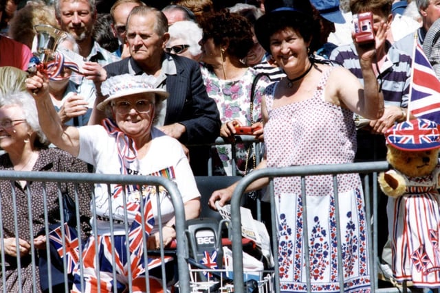 These folk are gathered to greet the Queen when she made a visit to the region in July 1994