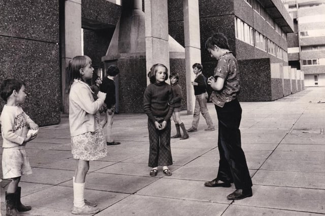 Child play in the shadow of Leek Street flats in August 1971.