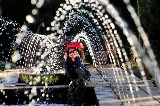 Greata Ruzzon from Leeds is pictured under the fountains in the gardens at Roundhay park, Leeds