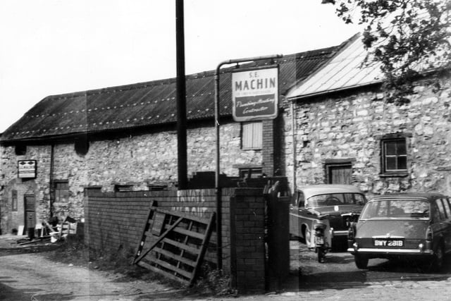 A view of the old stone business premises of S.E. Machin, plumbing and heating contractor on Station Road.