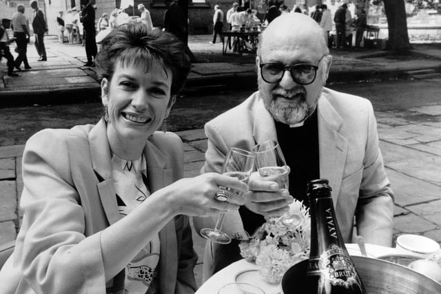 BBC Look North presenter Judith Stamper enjoys a glass of breakfast champagne with the Reverend David Murfet, priest in charge at Leeds Parish Church, before officially opening the church's annual summer fair.