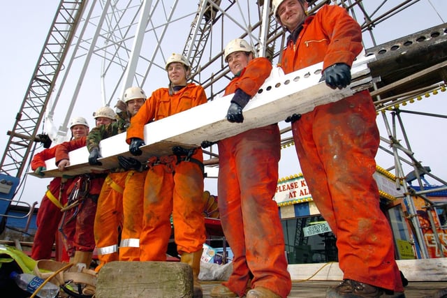 The new Big Wheel going up again on Blackpools Central Pier in 2010 after a refit. Putting the final ring beam in, are from left, Simon Bornand, Shane Taylor, Michael Docherty, Tony Lister, Anne Wilson and Alan Price.