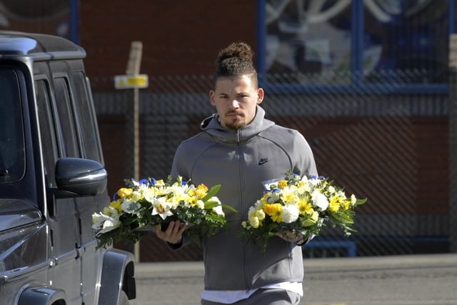 Kalvin Phillips prepares to lay flowers. Picture by Simon Hulme.