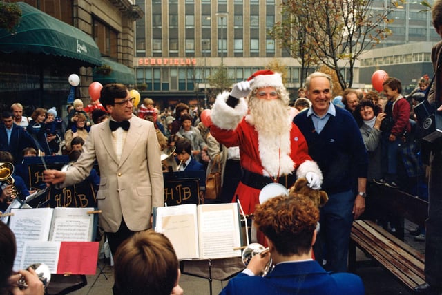 Santa receives smiles from the crowd as he helps conduct the jazz band during the Golden Jubilee celebrations in September 1982.