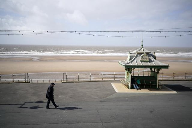 A lone police officer patrols the promenade (Photo by Christopher Furlong/Getty Images)