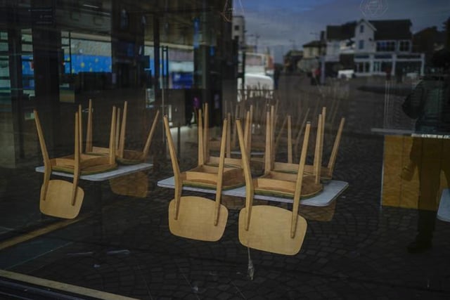 The view through a window of a closed and dormant cafe (Photo by Christopher Furlong/Getty Images)