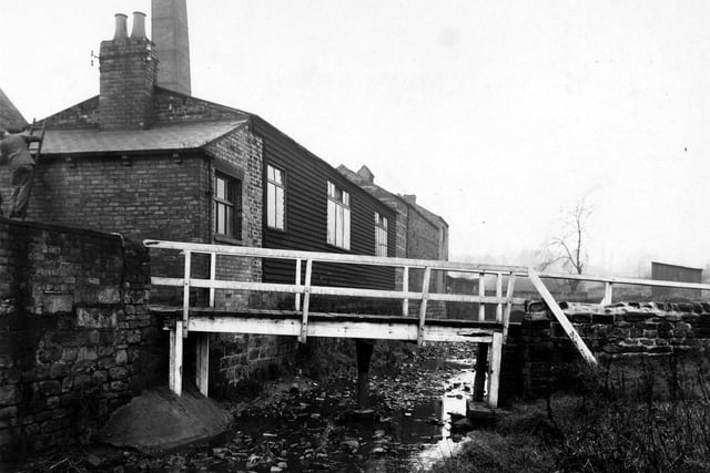 The footbridge over Meanwood Beck near the Dye Works on Wood Lane.