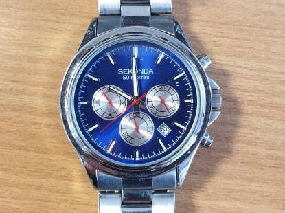 A watch seized by police during burglary investigation.