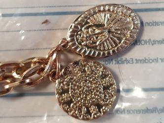 Close-up of jewellery seized by police during burglary investigation.