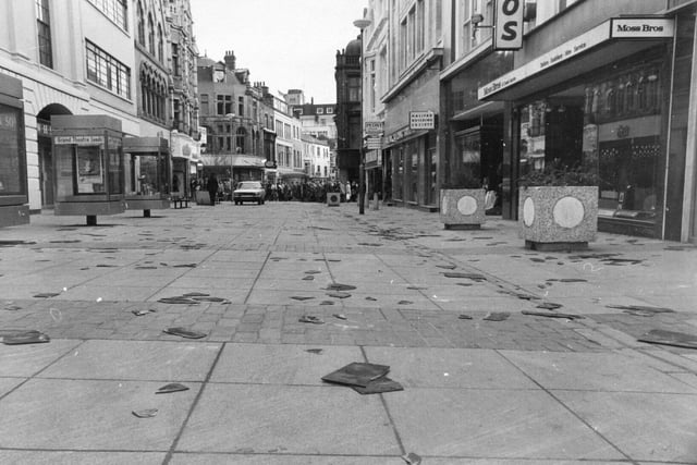 Slate-strewn Commercial Street was empty of shoppers after part of the pedestrian precinct was closed owing to gale force winds.
