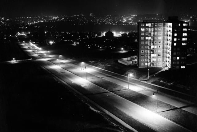 A view at night of Gipton Gate flats.