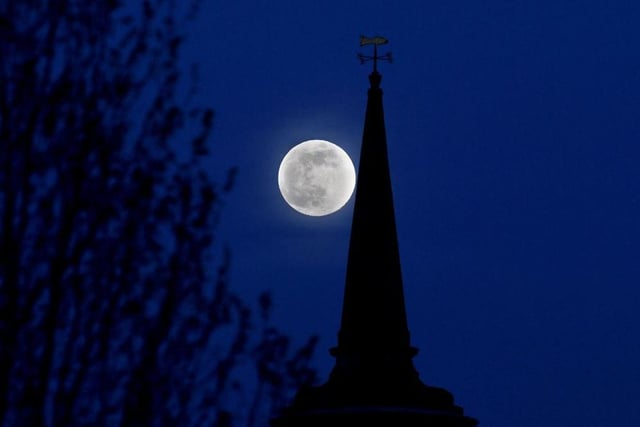 A haunting super moon over the rooftops and steeples of Lancaster