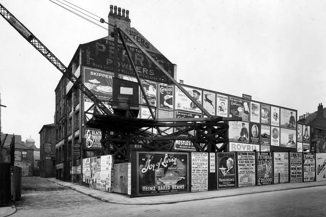 Hoardings around the site of Leeds Permanent Building Society looking from Guildford Street, which was later renamed The Headrow.