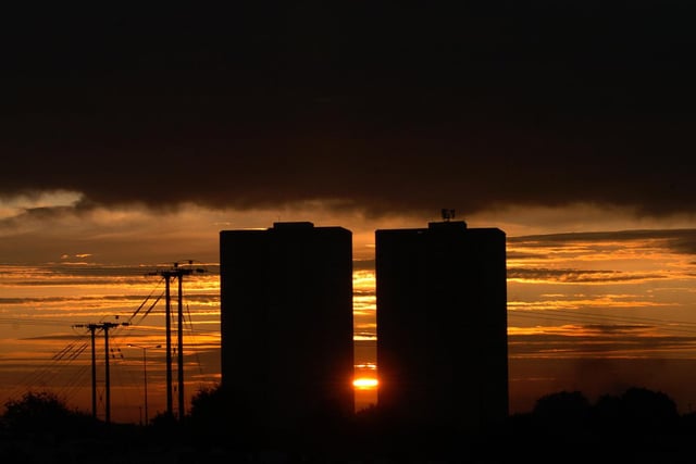 The sun rises behind Cottingley Towers.