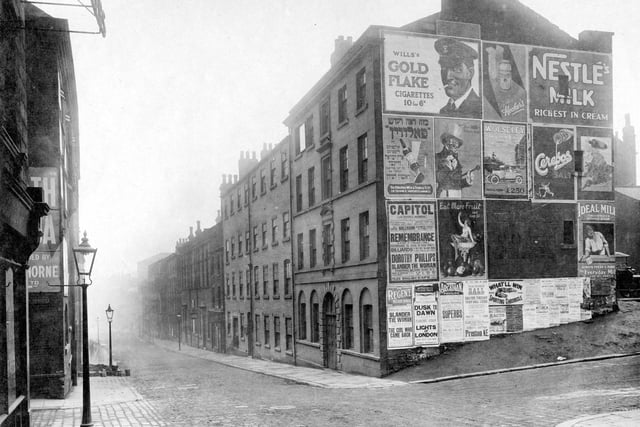 A view looking down Lady Lane to St Peter's Street. Junction on the left is Edward Street with factory of Henry Thorne. Sign advertising Cocoa can be partly seen on wall. The junction on the right is with Harewood Street.