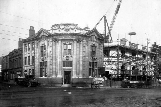 The junction of The Headrow and Vicar Lane. Pictured are two versions of Lloyds Bank. The building on the corner was put up around 1908, to the right new branch is being built. Original was to be demolished for widening of Headrow.