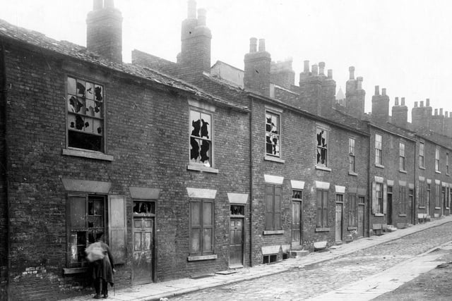 Little Templar Street. Situated off Templar Street, the property on the right has been demolished leaving an area of cleared ground. Houses on the left are derelict.