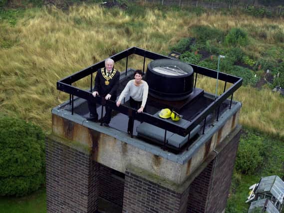 Pictured in August 2000, Mayor of Wakefield Coun Norman Hazell and Helen Knowles from Wakefield Hospice prepared to abseil from the top of the training tower at Wakefield Fire Station.