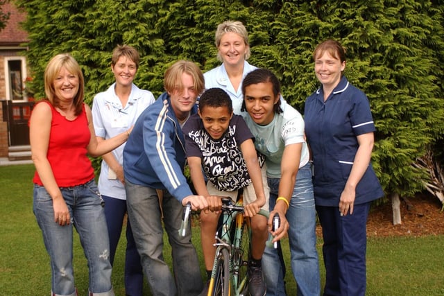Diane Lodge, Ann-Marie Guest, James Lodge, Jason McKie, Sandra Wild, Daniel McKie and Michelle Sykes prepare for a sponsored cycle ride in aid of the Hospice in 2004.