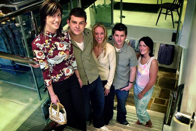Celebrations as Frank Bird donates designer clothing to the hospice, 2005. Pictured are Emma Weightman, Neil Tennant, Samantha Young, Dave Bailey and Wakefield Hospice Volunteer Services Manager Melissa Standeven.