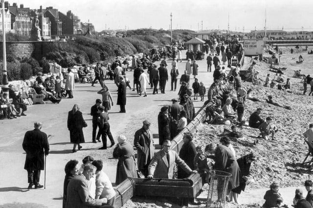 In April 1963, the weather was glorious and brought out crowds of families in St Annes. Children were enjoying the sand whilst their parents and grandparents relaxed in the sun.