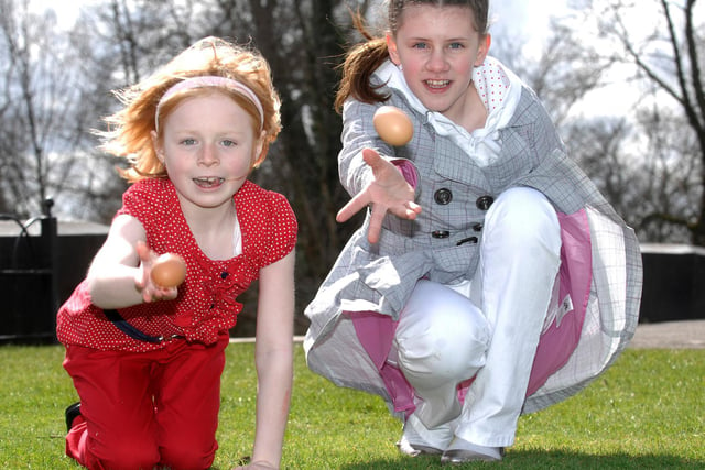 Charlotte and Leah, right, take part in egg rolling, part in Easter activities in Mesnes Park, Wigan, April 2011.