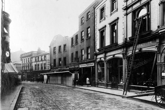 Bond Street looking towards the  junction with Albion Street. Premises visible are, from right to left, Powolny's Restaurant, Waletr Allsop Florist, Madame Arthur Costumier and a derelict building.