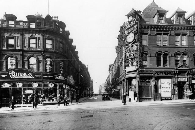 The corner of Briggate and Lower Headrow, across the junction with Briggate to the left and New Briggate to the right looking along Upper Headrow. Burton's, tailors, can be seen.