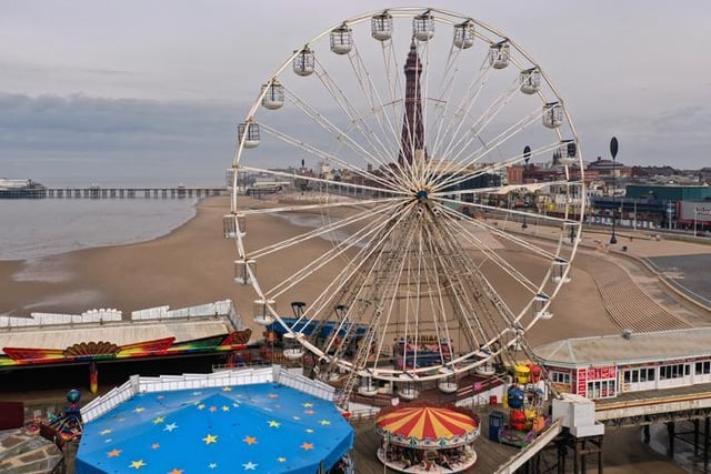 Fairground rides lay dormant and the beach and promenade deserted