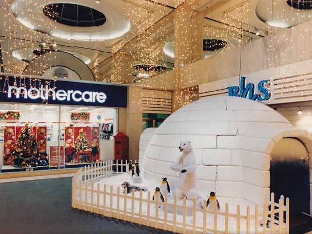 A slightly surreal scene from January 1995 with Mothercare and BHS surrounded by an igloo featuring a seal, polar bear and penguins.