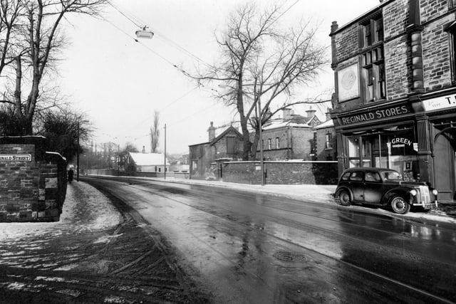 A view from Reginald Street junction across Chapeltown Road to number 176, Reginald Stores on the corner with Back Newton Grove.
