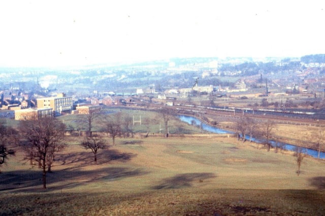 A view of Gott's Park looking across the river, canal and railway lines towards Kirkstall. Benjamin Gott High School can be seen centre left.