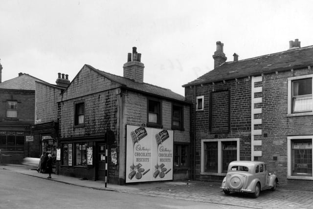 Armley Town Street looking at the premises of Gibbs and Son, Newsagent. Next door is the 'Concert Rooms'. 'Lloyds Bank Ltd. can be seen in the far left of the photo.